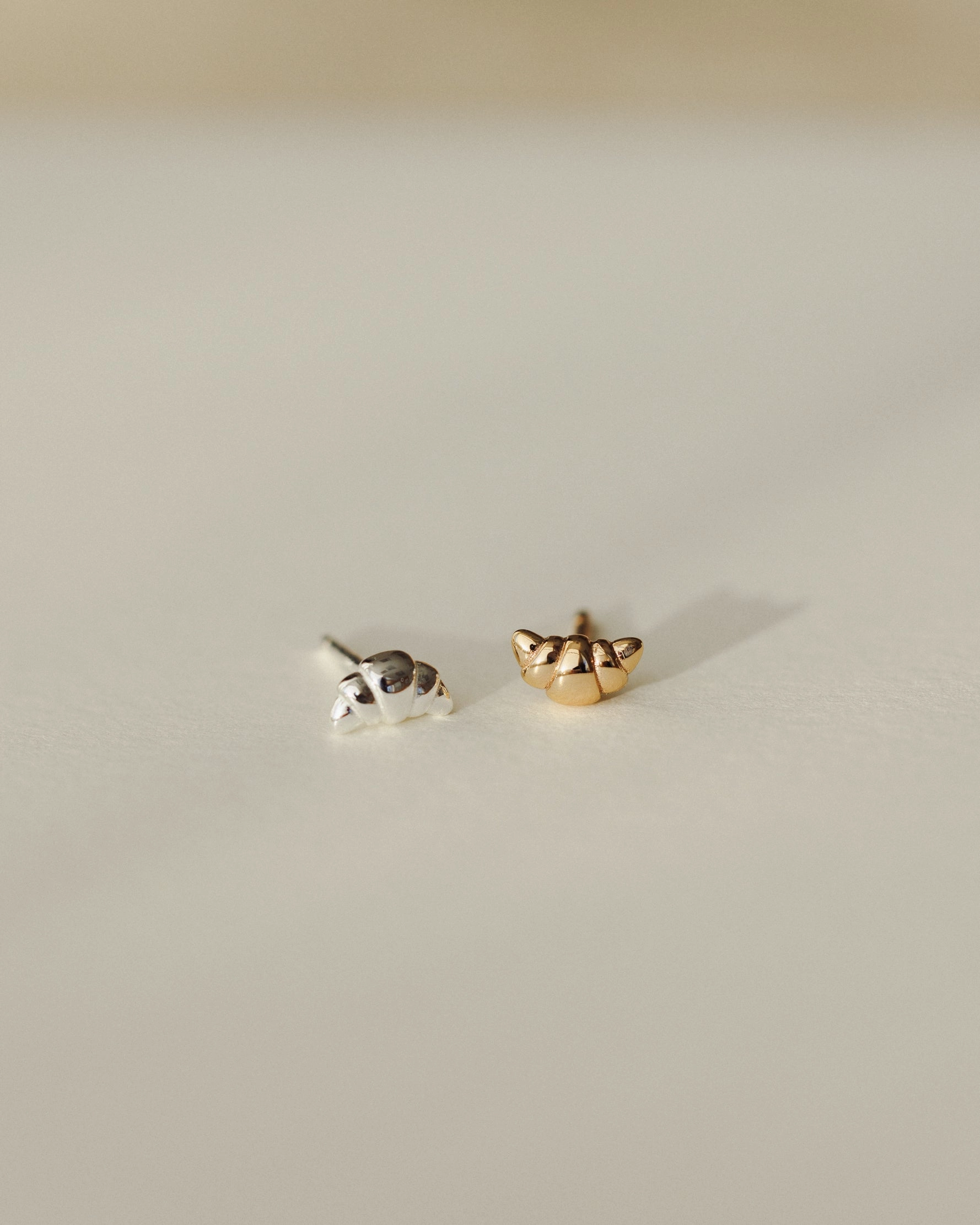 Lustrous Trinket Triangular Accessory Croissant Studs