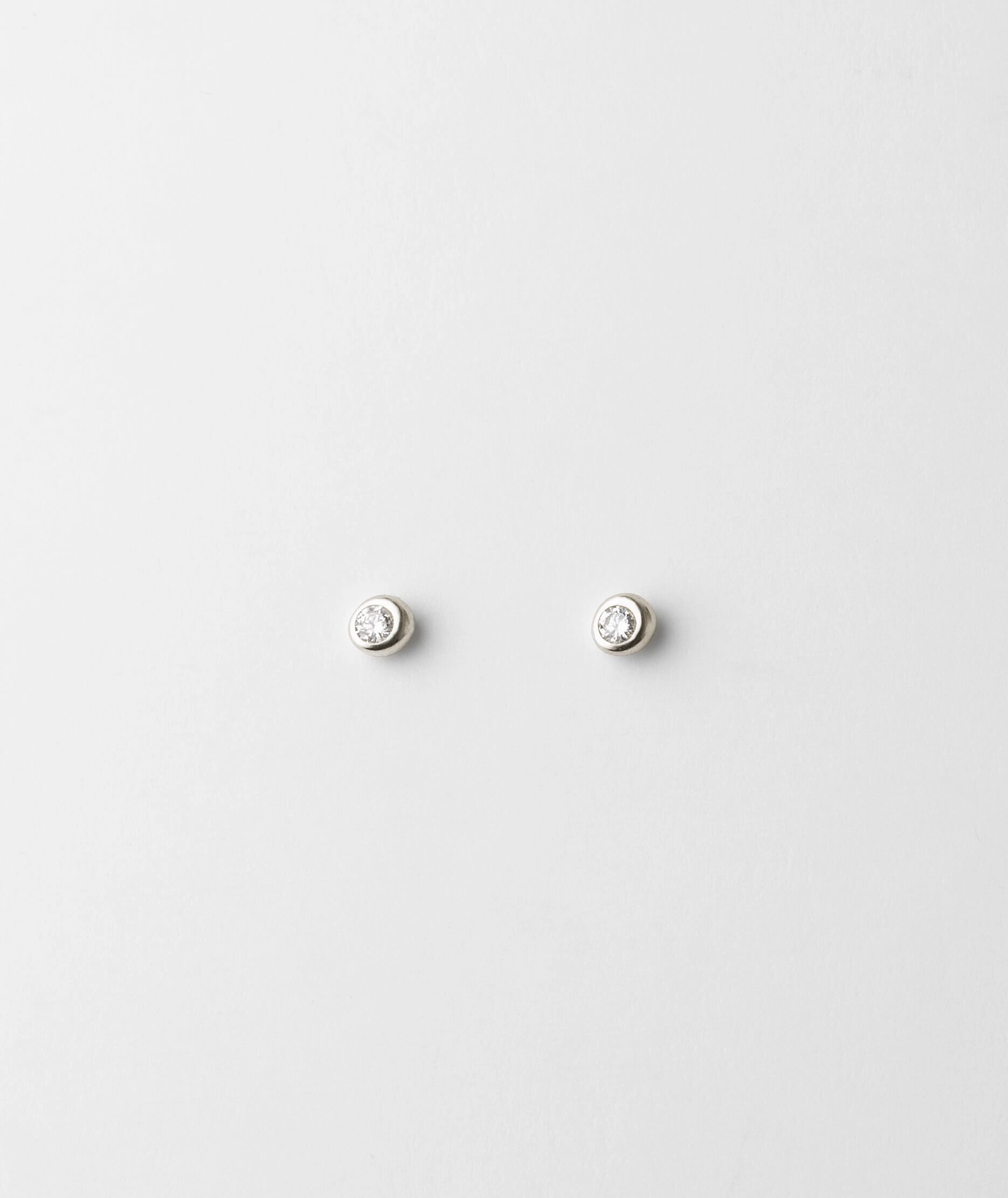Gaia White Sapphire Solitaire Studs comfortable option