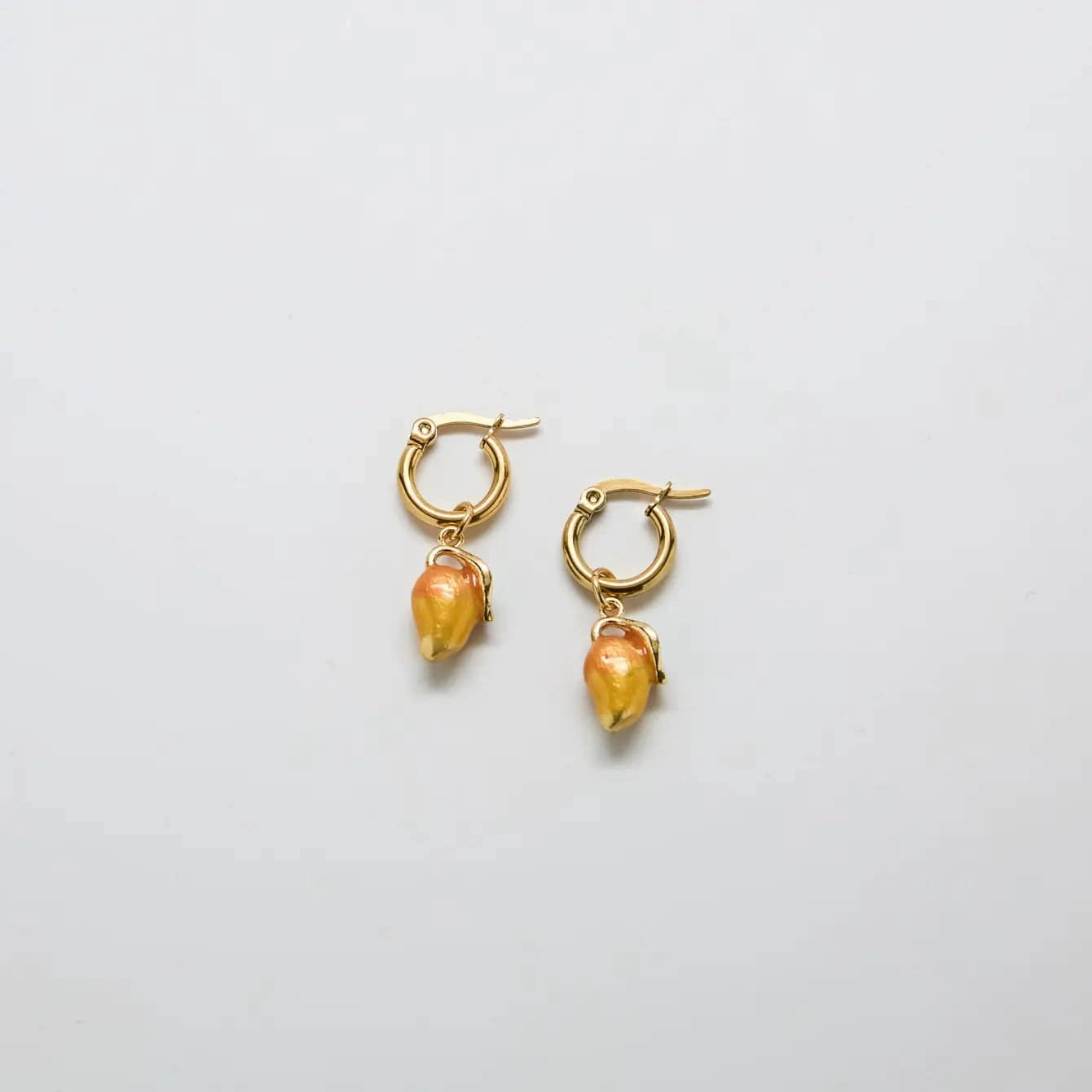 Oval Adornment Gold Mango Huggie Hoops