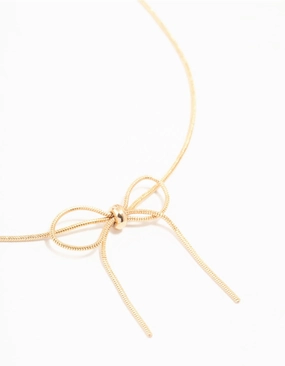 Gold Snake Bow Necklace Soft Reflection