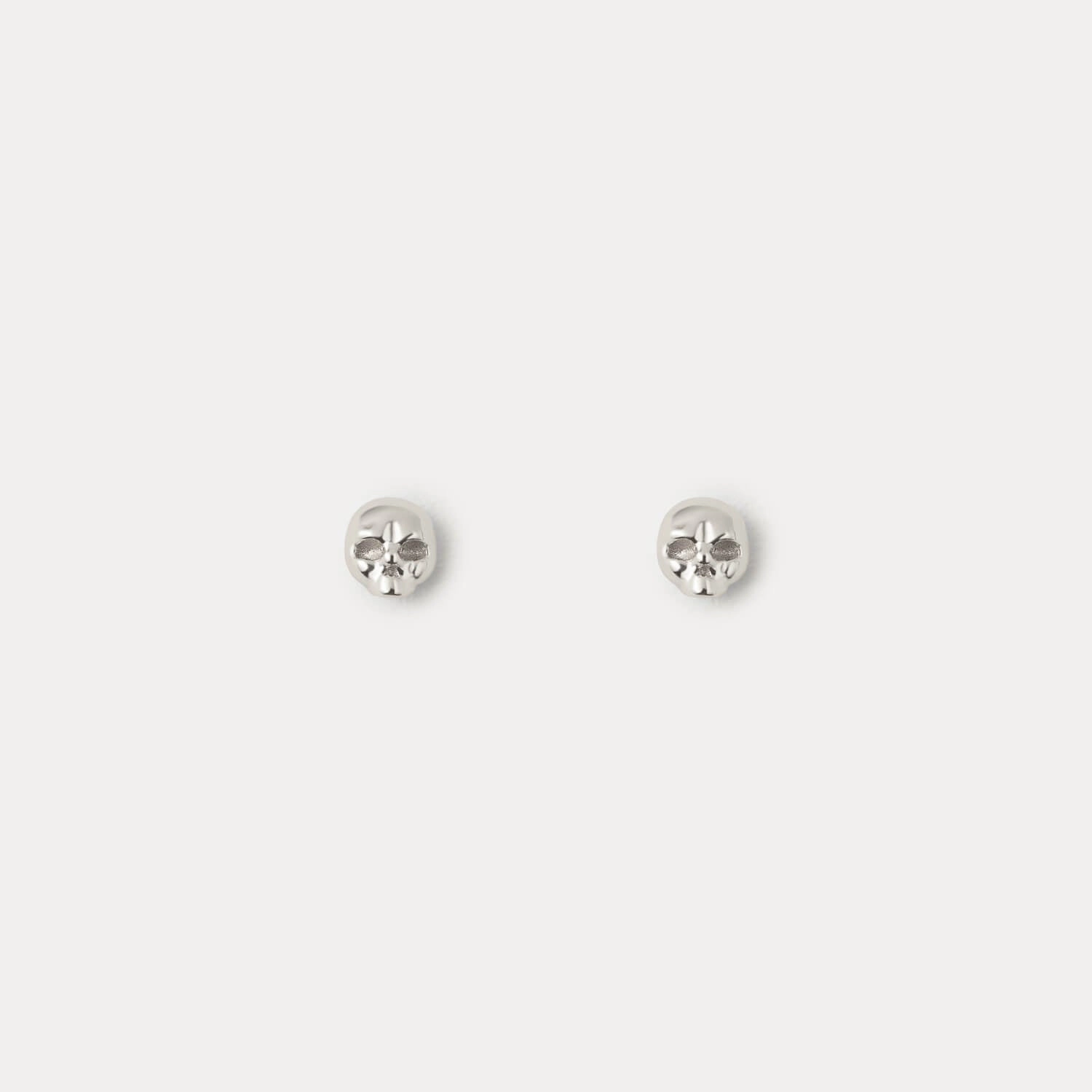 Skull Studs Neutral Accent Shiny Piece