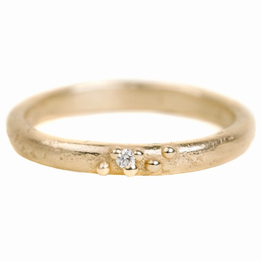 Fashionable Sparkle Textured Half Round Wedding Band In Yellow Gold With A Diamond