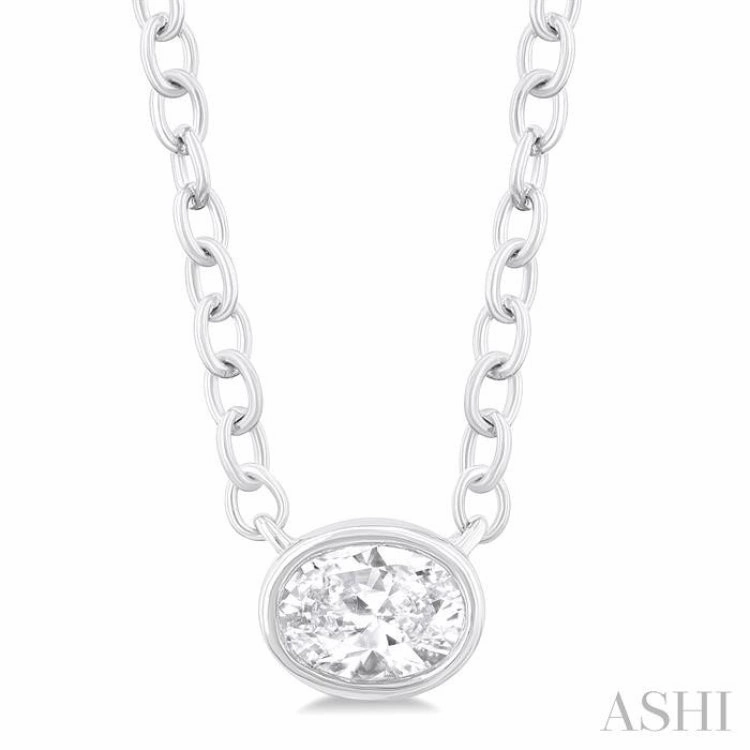 1/6 Ctw Petite East-West Bezel Set Oval Cut Diamond Fashion Pendant With Chain in 10K White Gold Perfect Accessory For School